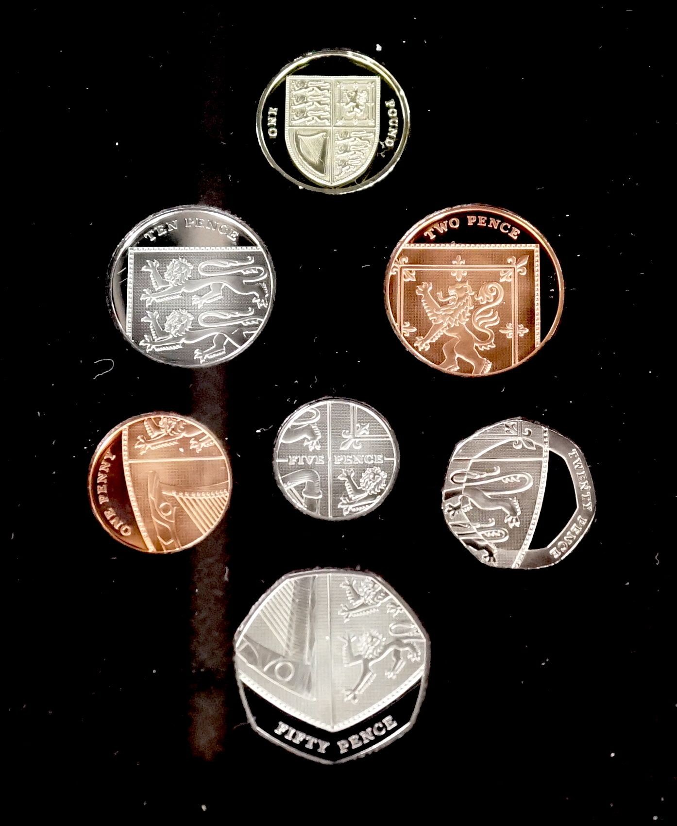 Cased Royal Mint proof coin sets – UK 1996 Silver Wedding Anniversary silver coin collection, 2012 year set, 2008 Royal Shield of Arms, together with a Channel Islands Diana Crown set 2002